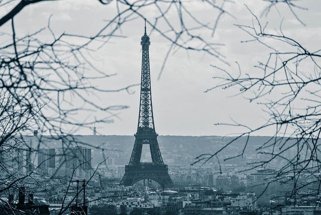 A photo of the Eiffel Tower on a grey winter's day.